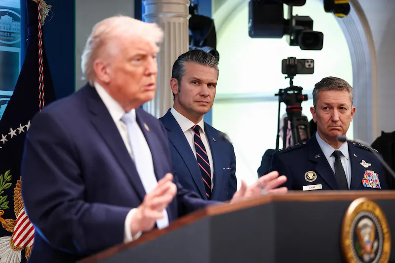 President Trump with Secretary Hegseth and General Dan Caine behind him.