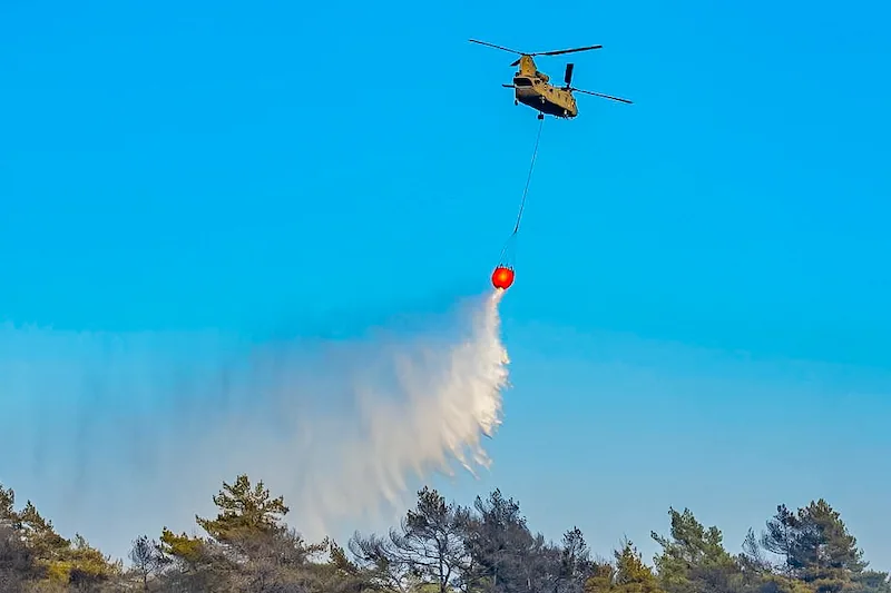 The air force is deploying heavy transport helicopters to help fight the major fire.