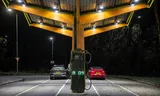 Electric cars on the charger at a Fastned charging station along the A16.