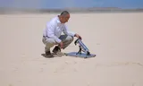 Omar Yaghi with a prototype in Death Valley, one of the hottest and driest places on earth.