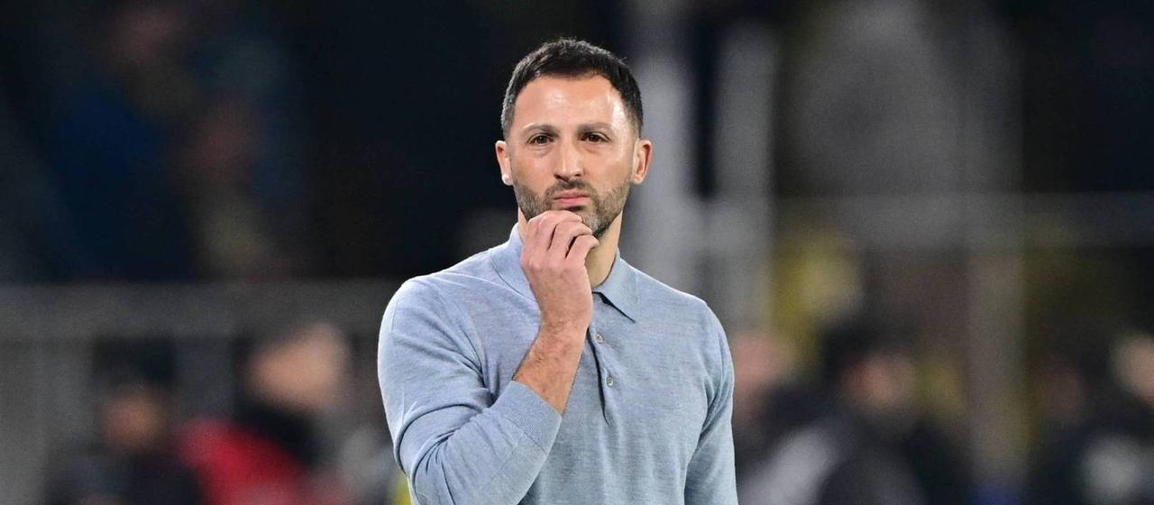 Coach Domenico Tedesco follows his team's game