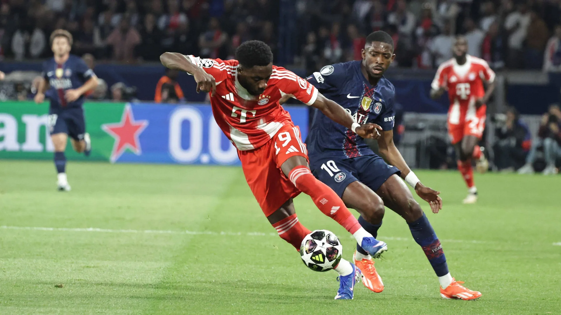 Hard work: Bayern's Davies (left) against Paris' Dembélé. Hard work: Bayern's Davies (left) against Paris' Dembélé.