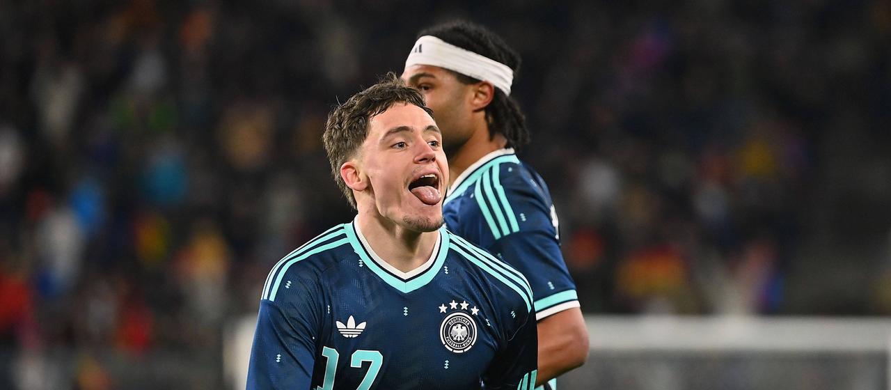 Florian Wirtz (from) celebrates his second goal in the game against Switzerland