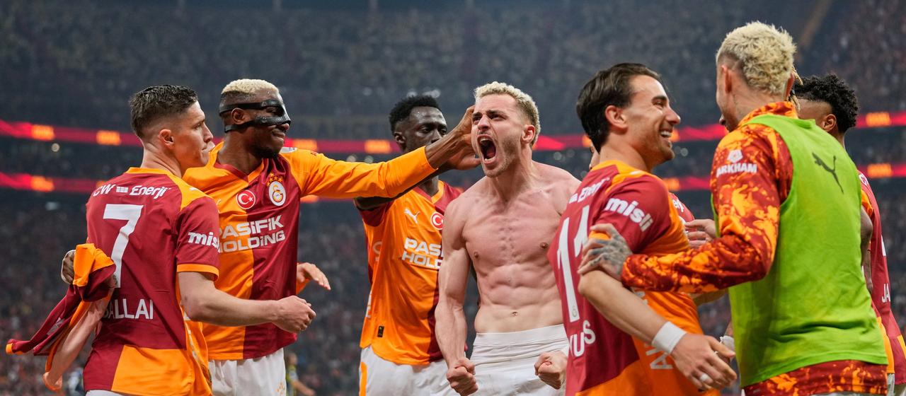Baris Yilmaz cheers with teammates in the game against Fenerbahce