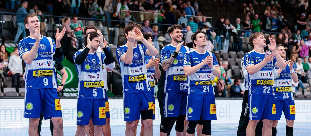 The ThSV Eisenach team celebrates after a 29:34 victory.