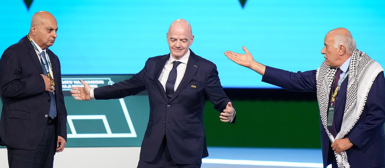 (from left) Israel's association vice-president Basim Sheikh Suliman, FIFA President Gianni Infantino and the Palestinian association head Jibril Rajoub