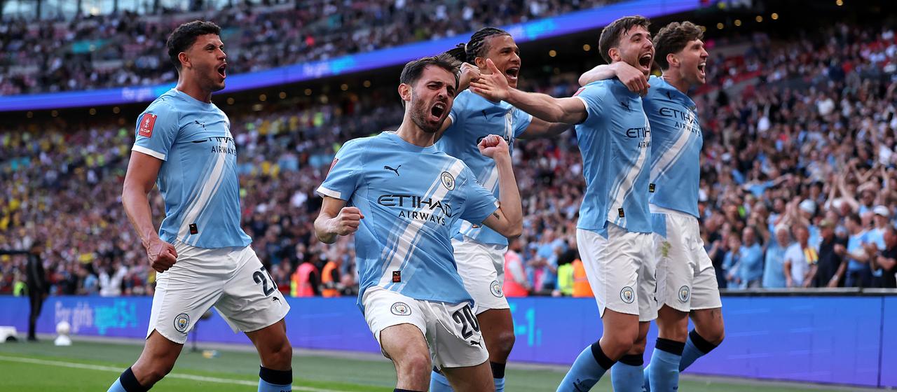 Football professionals from Manchester City celebrate in the semi-final of the FA Cup against Southampton FC