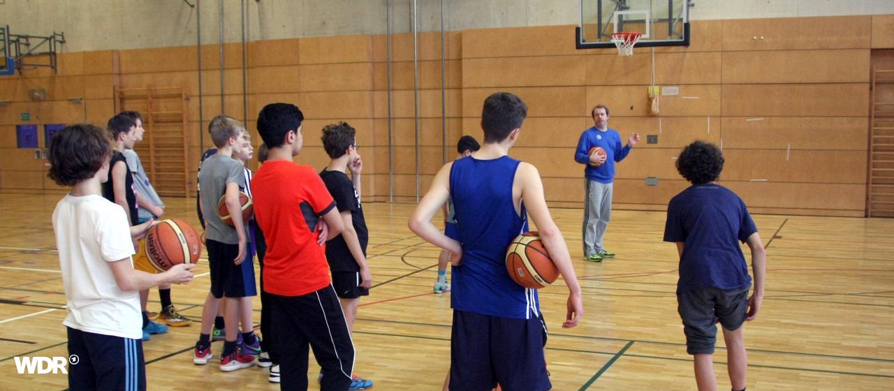 Young people at basketball training