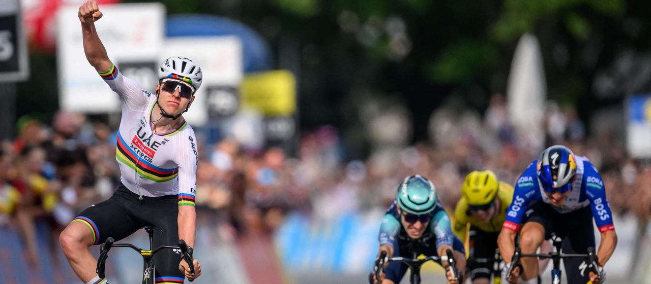 Tadej Pogacar celebrates his victory on the first stage of the Tour of Romandie