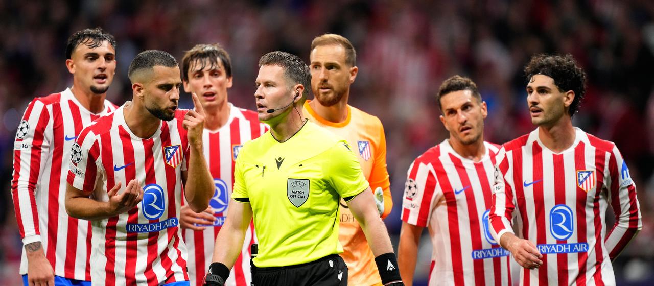 Atletico Madrid players react after referee Danny Makkelie awarded Arsenal a penalty. 