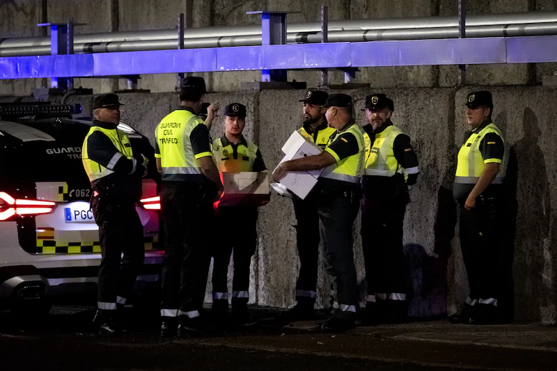 Police in the port of Granadilla. The Dutch-flagged cruise ship MV Hondius, which has been hit by a deadly outbreak of the hantavirus, anchors off Tenerife.