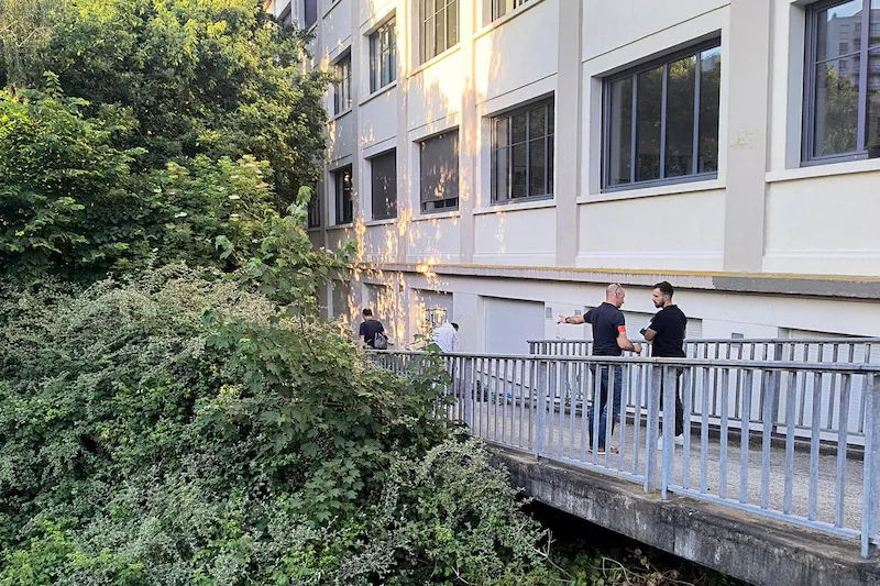 Detectives at the spot where the 11-year-old boy was found.
