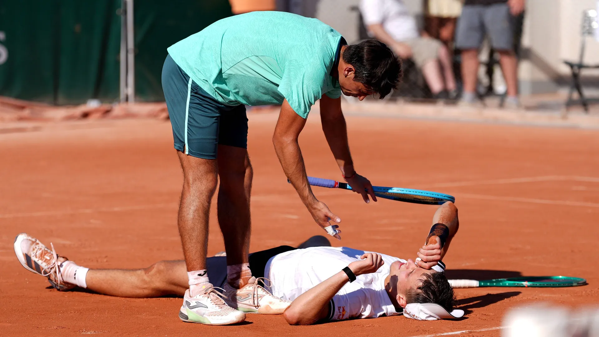Mariano Navone looks after his opponent.