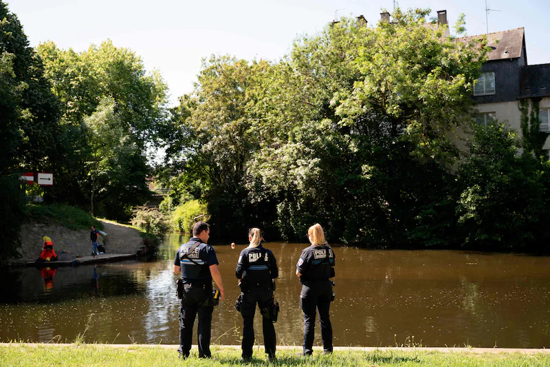 Detectives at the spot where the 11-year-old boy was found.