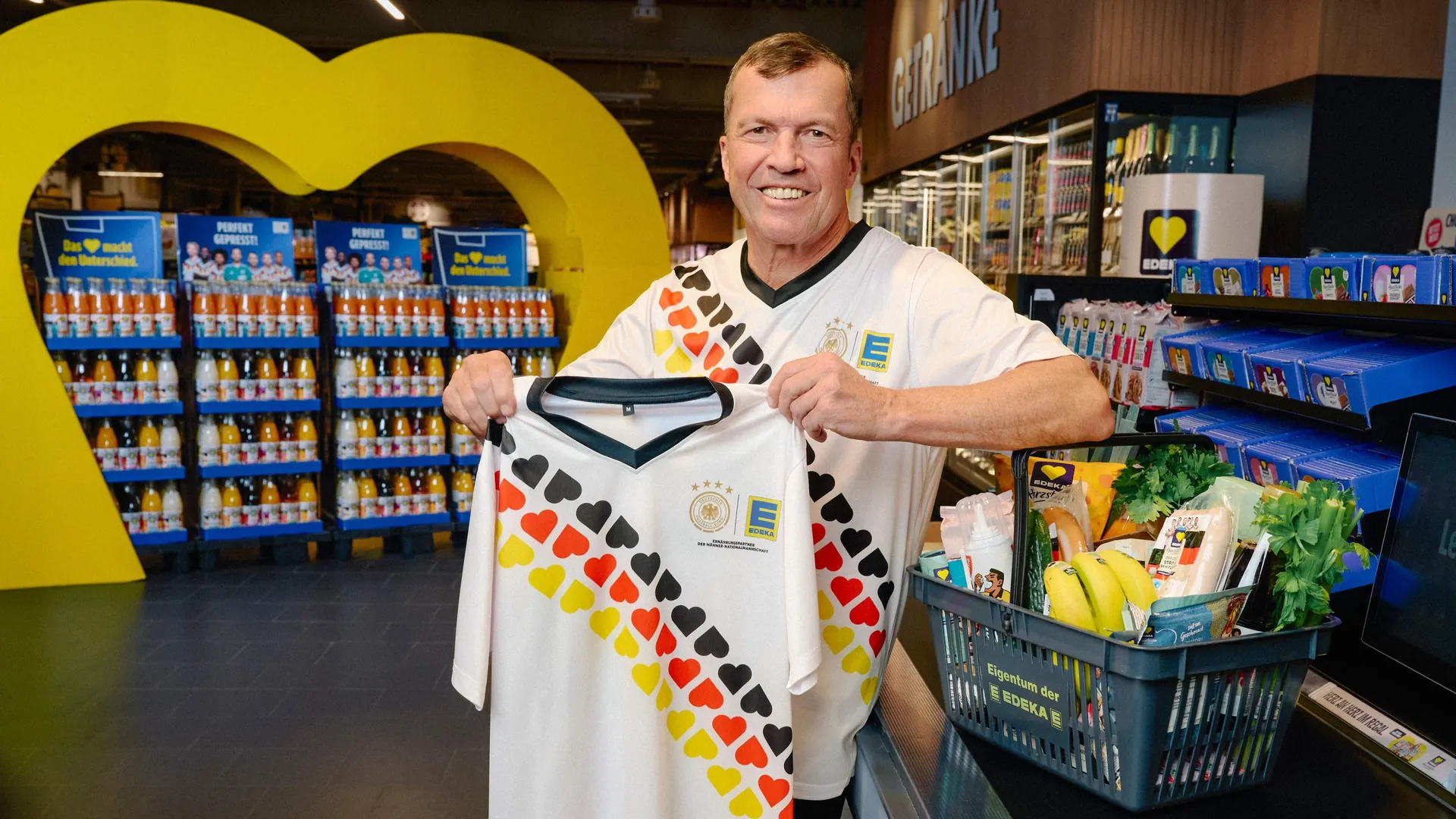 Football legend: Lothar Matthäus poses with a fan shirt from Edeka. Football legend: Lothar Matthäus poses with a fan shirt from Edeka.