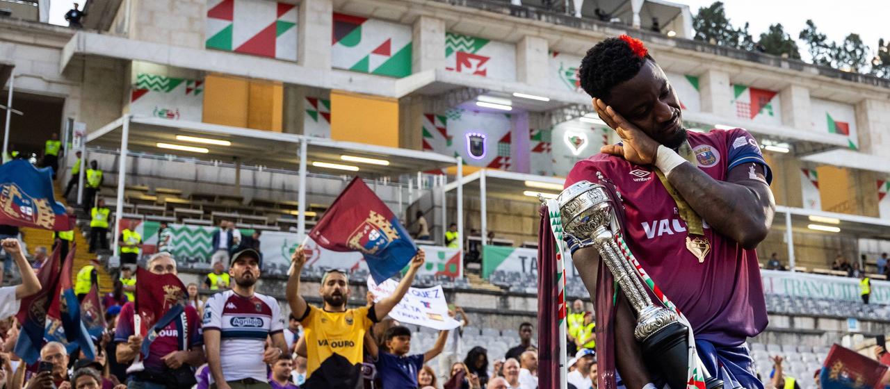 A player from SCU Torreense celebrates the cup victory with the fans