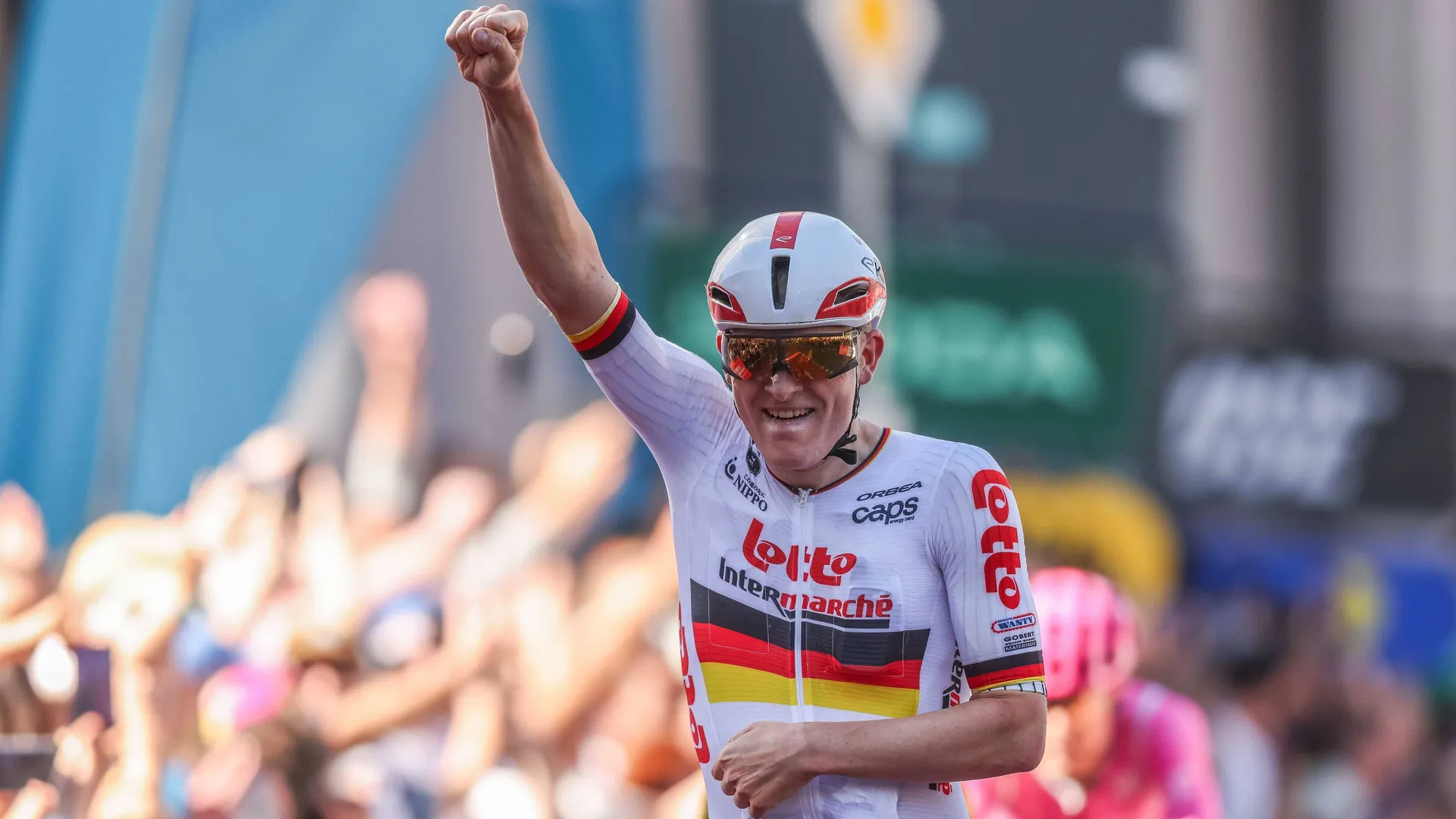 Beaming winner: Georg Zimmermann crosses the finish line celebrating.
