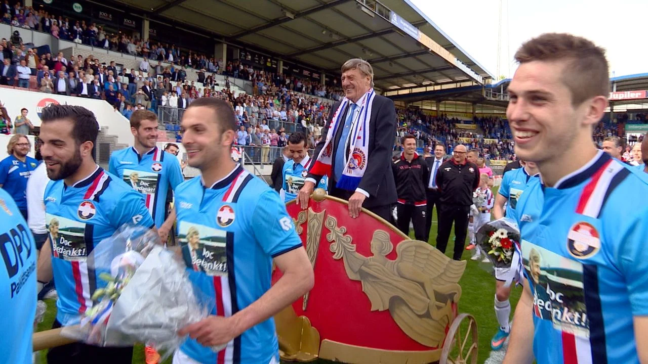 Jan Vioen is pulled through the stadium on a cart