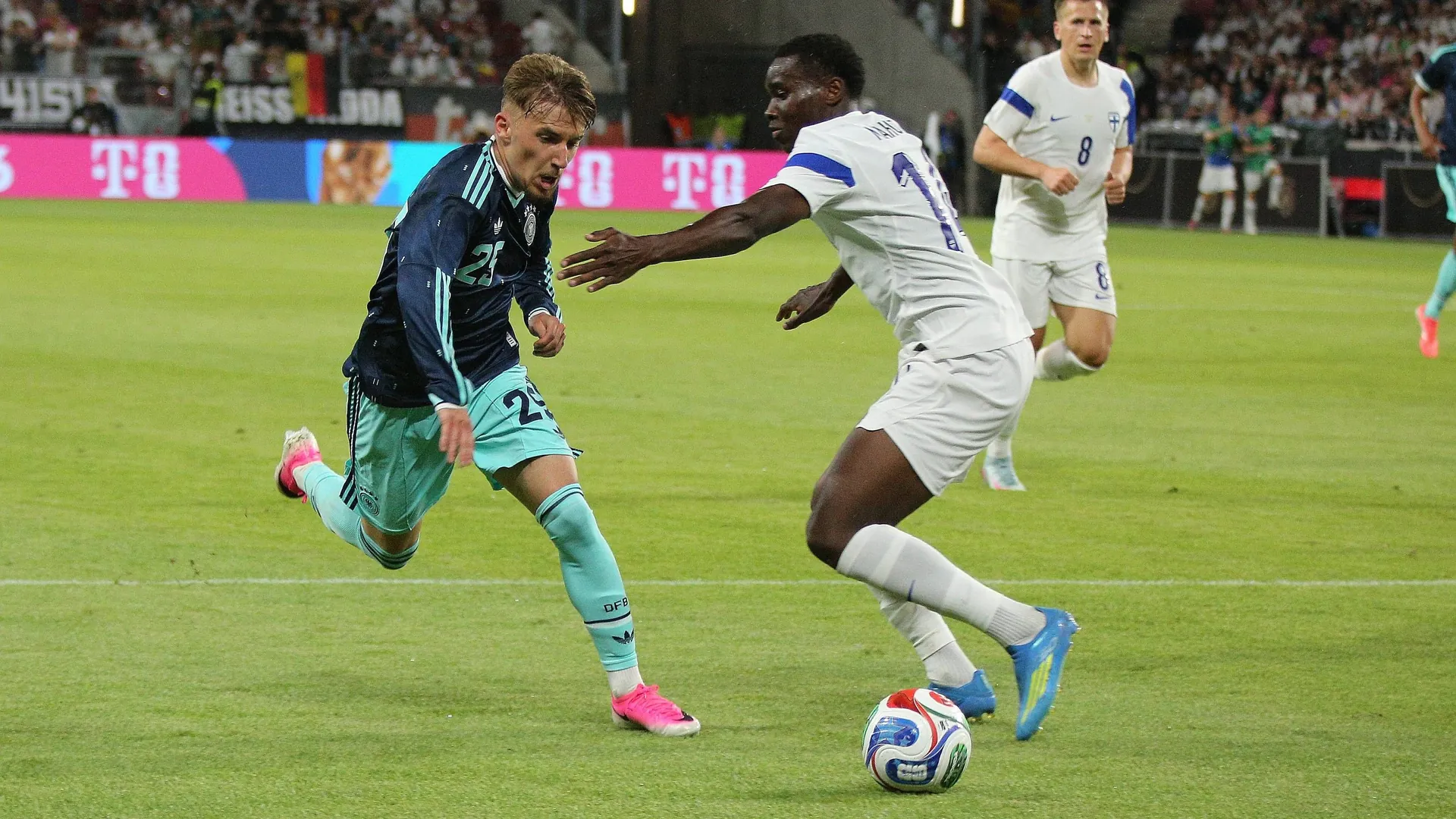 Strong performance: Lennart Karl (left) passes Finland's Ryan Mahuta.