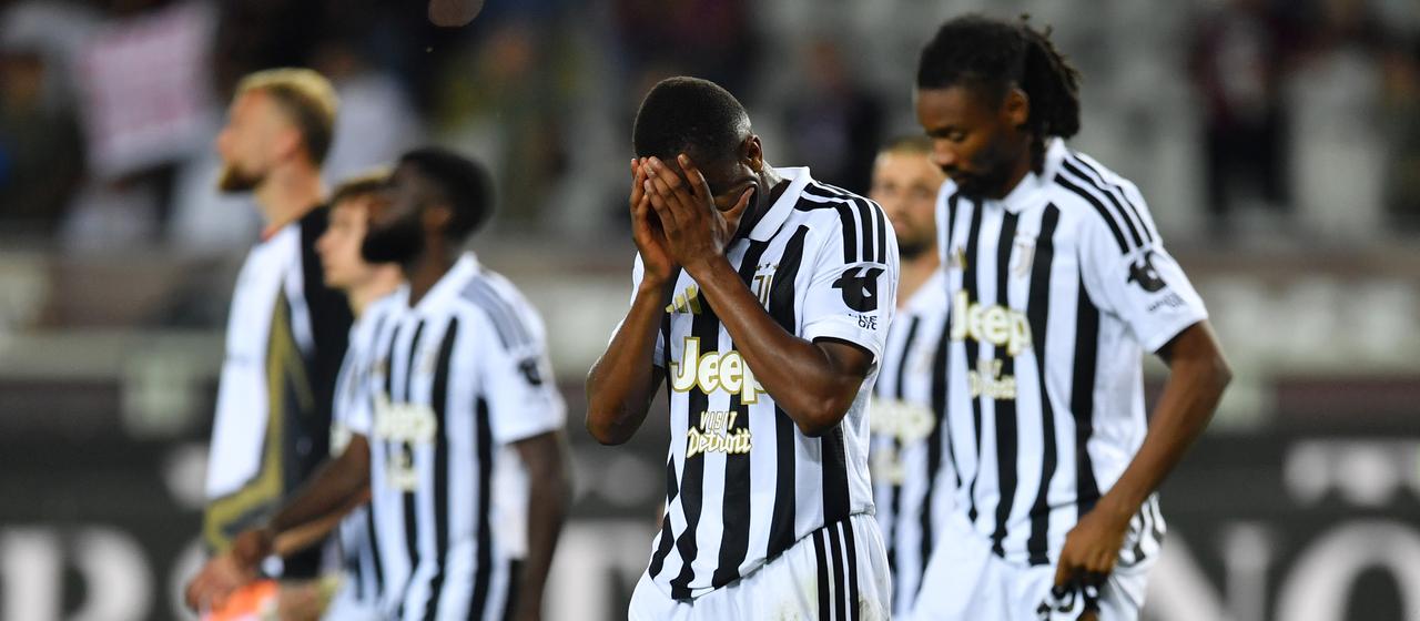 Juventus' Pierre Kalulu (from) buries his face in his hands in disappointment
