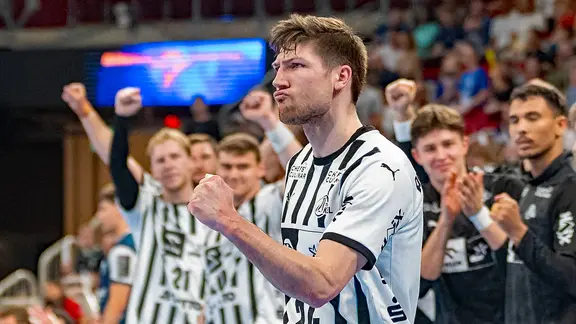 Lukas Zerbe from THW Kiel clenches his cheering fist