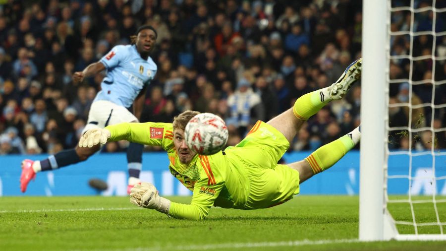 Photogallery Salford City's English goalkeeper, Matt Young, observes how he cannot prevent the goal of Manchester City's Belgian midfielder, Jeremy Doku