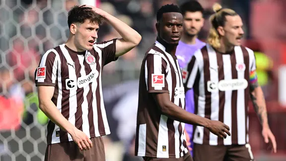 St. Pauli's players react to a goal
