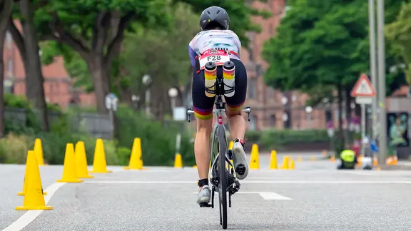 Participant in the Ironman in Hamburg on her bike