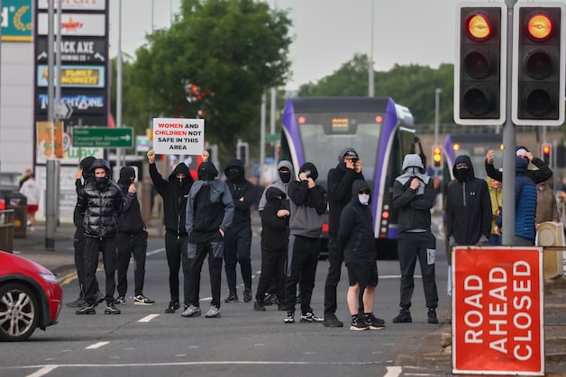 Protesters block a street in north Belfast. (09/06/26)