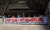 A protest against the SpaceX IPO and its very rapid inclusion in all stock market indices on the doorstep of JP Morgan Chase in New York. The largest bank in the world is one of the accompanying banks.