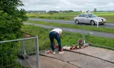 Flowers, cuddly toys and candles are placed along the N290 in Zeeland, at the spot where the fatal traffic accident occurred.