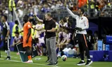 Ronald Koeman and Netherlands assistant coach Ruud van Nistelrooij during the match against Japan.