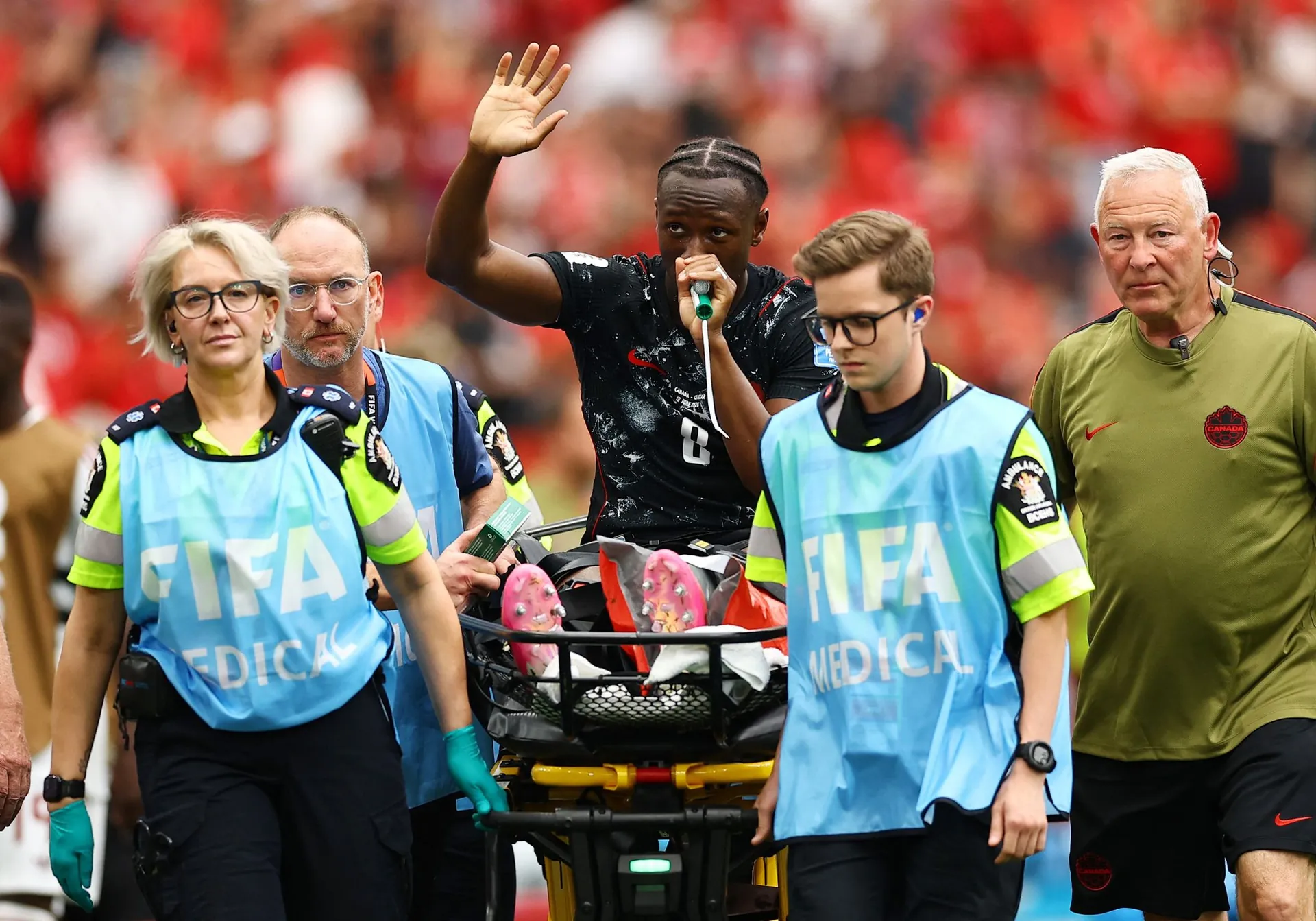 Ismaël Koné waves to the fans as he is taken away. Ismaël Koné waves to the fans as he is taken away.