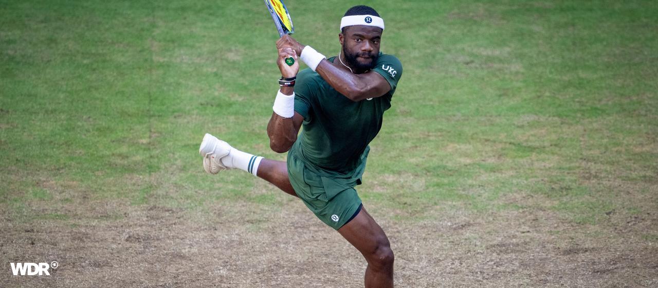 Tennis professional Frances Tiafoe hits a backhand in the final in Halle