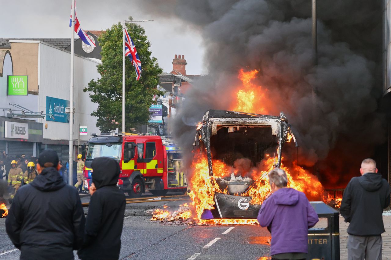 Demonstrations following a stabbing incident in Belfast result in riots, buses set on fire and roads blocked