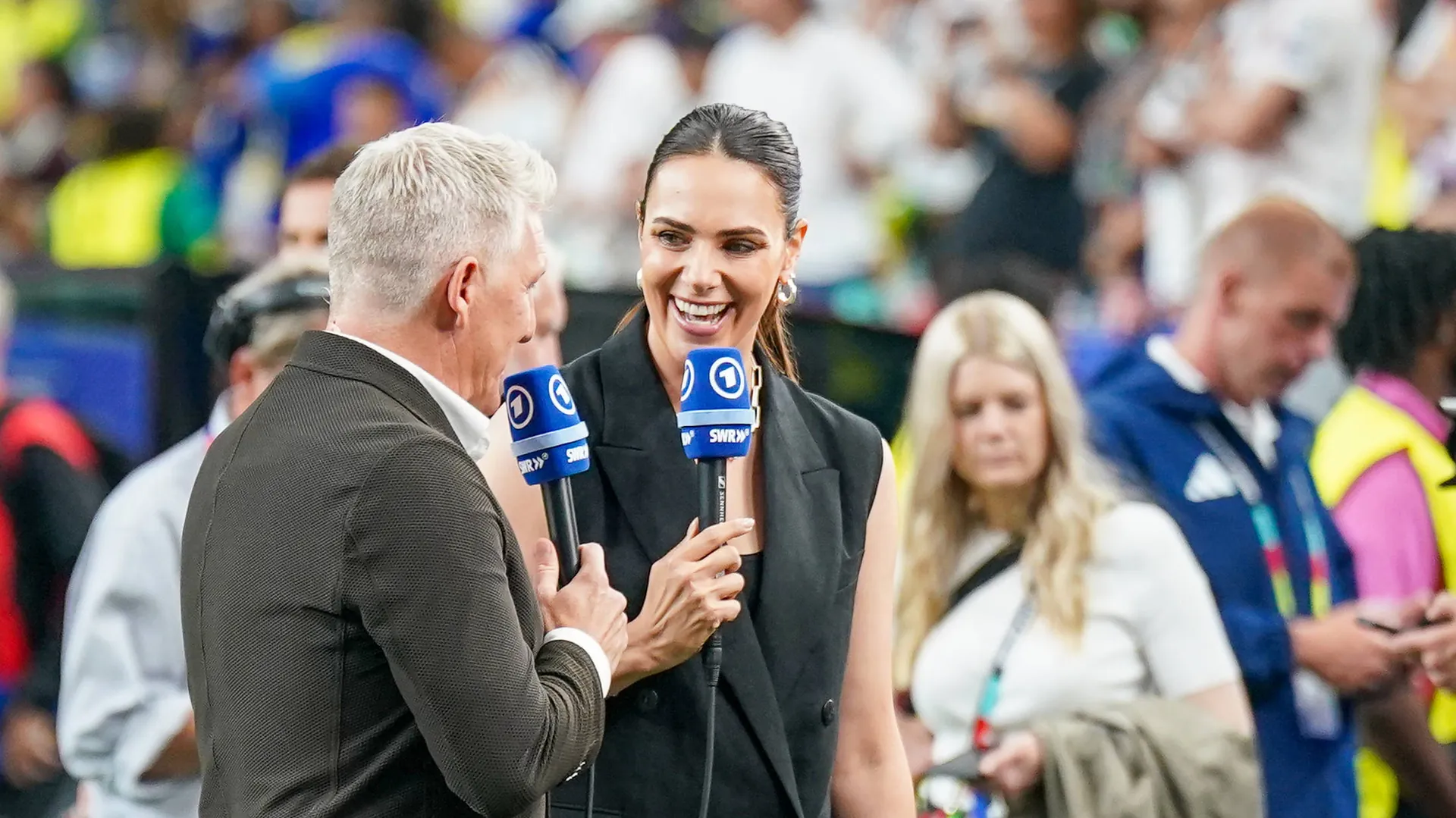 Esther Sedlaczek (r.) and Bastian Schweinsteiger at the German team's opening World Cup game against Curaçao. Esther Sedlaczek (r.) and Bastian Schweinsteiger at the German team's opening World Cup game against Curaçao.