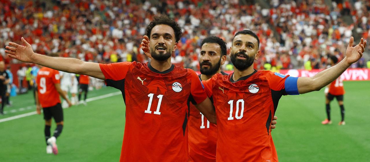 Mo Salah and Mostafa Zico celebrate after Egypt's 2-1 win 