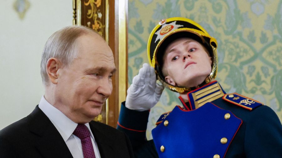 Photogallery Russian President Vladimir Putin walks past an honor guard before meeting his Belarusian counterpart at the Moscow Kremlin