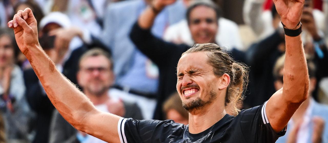 Raises his hands up in celebration - Alexander Zverev after winning the French Open