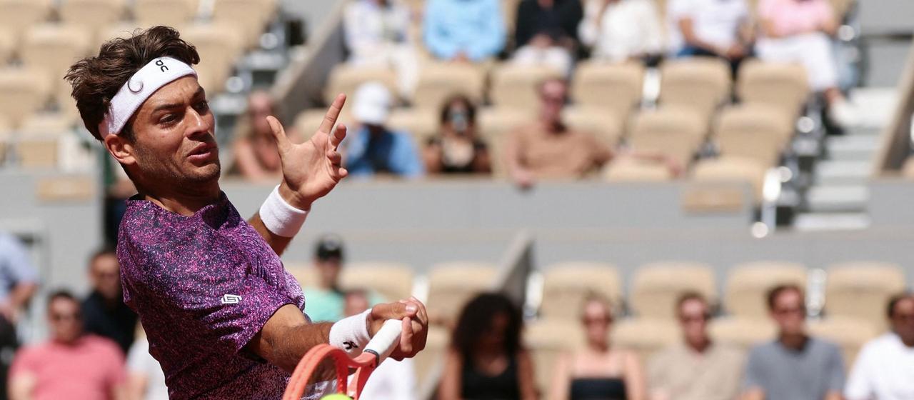Italy's Flavio Cobolli in front of empty stands at the French Open