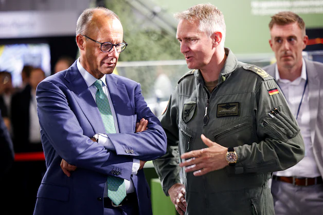 Holger Neumann with German bondsman Friedrich Merz.
