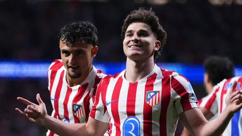 Julian Alvarez (M.) from Atletico Madrid celebrates after scoring a goal for his team.
