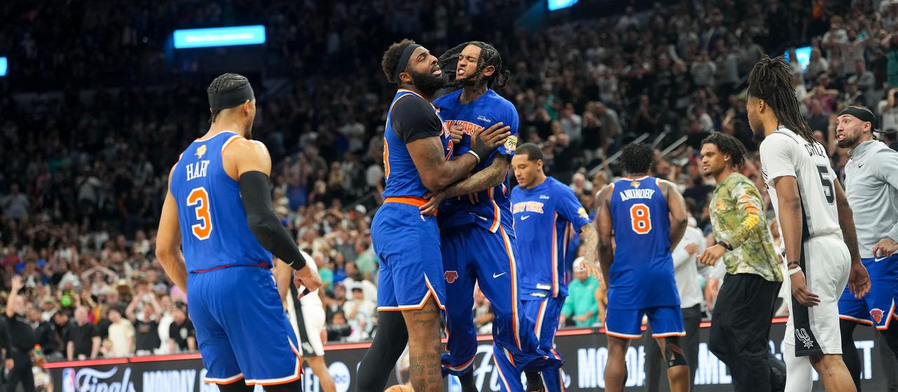 The New York Knicks celebrate after the final whistle of the game against the San Antonio Spurs