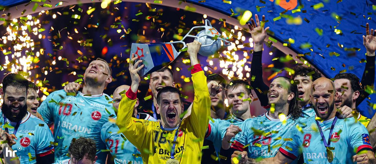 Goalkeeper Nebojsa Simic (with trophy) and his colleagues from MT Melsungen celebrate the European Cup victory.