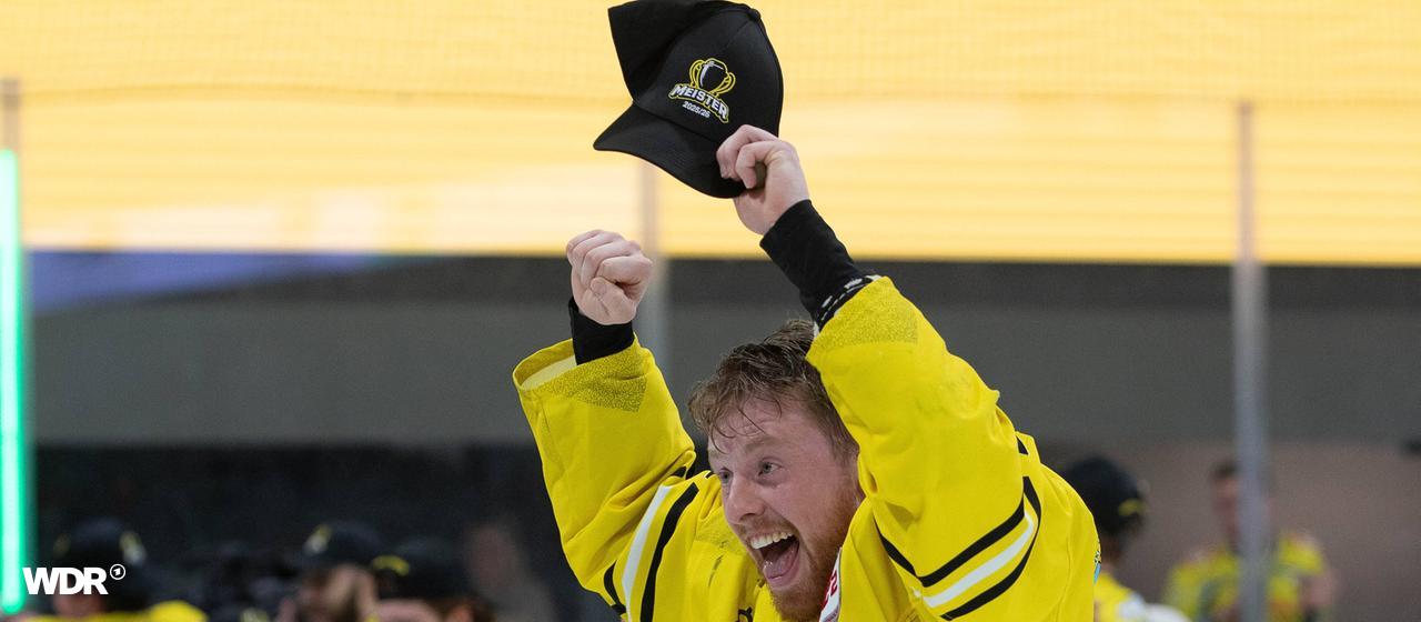 Erik Buschmann from the Krefeld Pinguinen celebrates winning the DEL2 championship