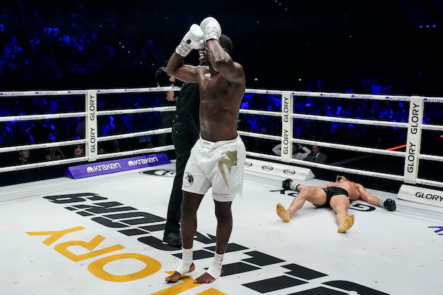 Mory Kromah celebrates his victory, Milos Cvjeticanin has the lights out.