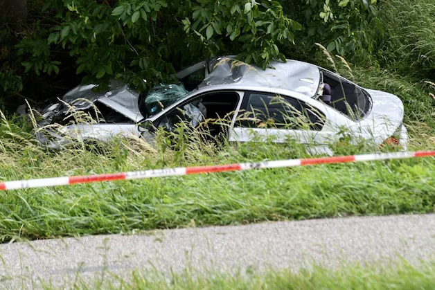 The car slid off the road in a bend.