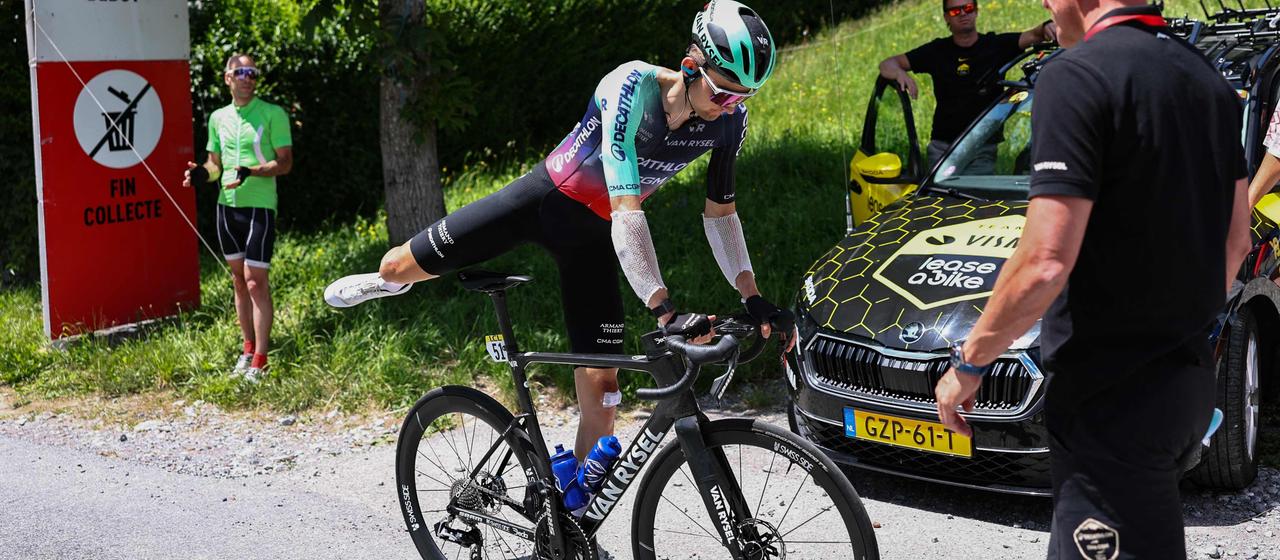Paul Seixas gets off his bike