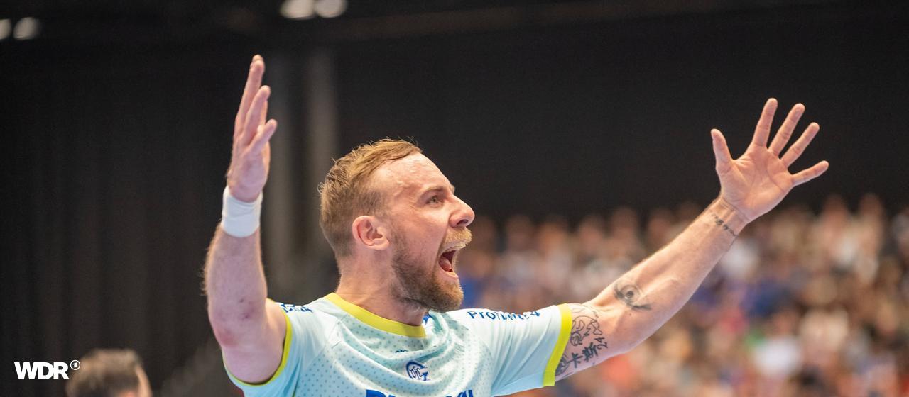 Gummersbach's Lukas Blohme tries to motivate the away fans