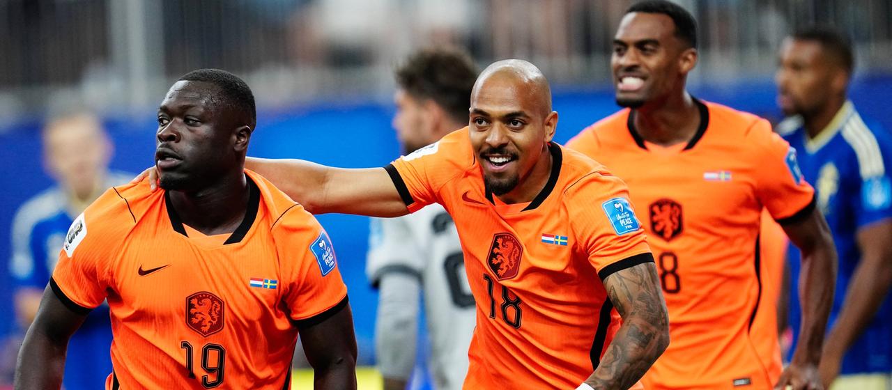 Netherlands' Brian Brobbey celebrates his goal with teammate Donyell Malen